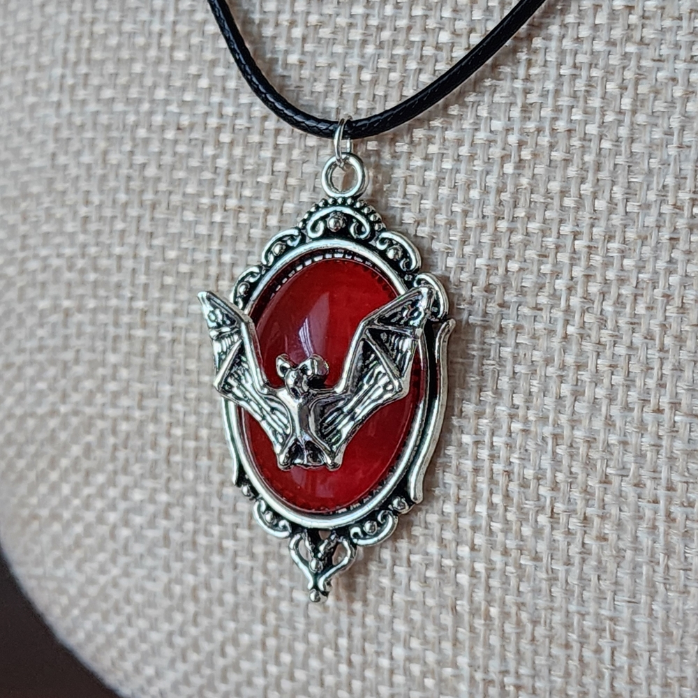 Silver Bat Framed In Red Pendant Necklace